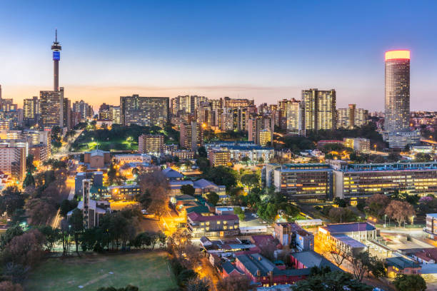 Johannesburg cityscape panorama sunset with the residential hillbrow suburb and the iconic Telkom communication tower to Ponte tower. Johannesburg is one of the forty largest metropolitan cities in the world, and the world's largest city that is not situated on a river, lakeside, or coastline. It is also the source of a large-scale gold and diamond trade, due being situated in the mineral-rich Gauteng province.
